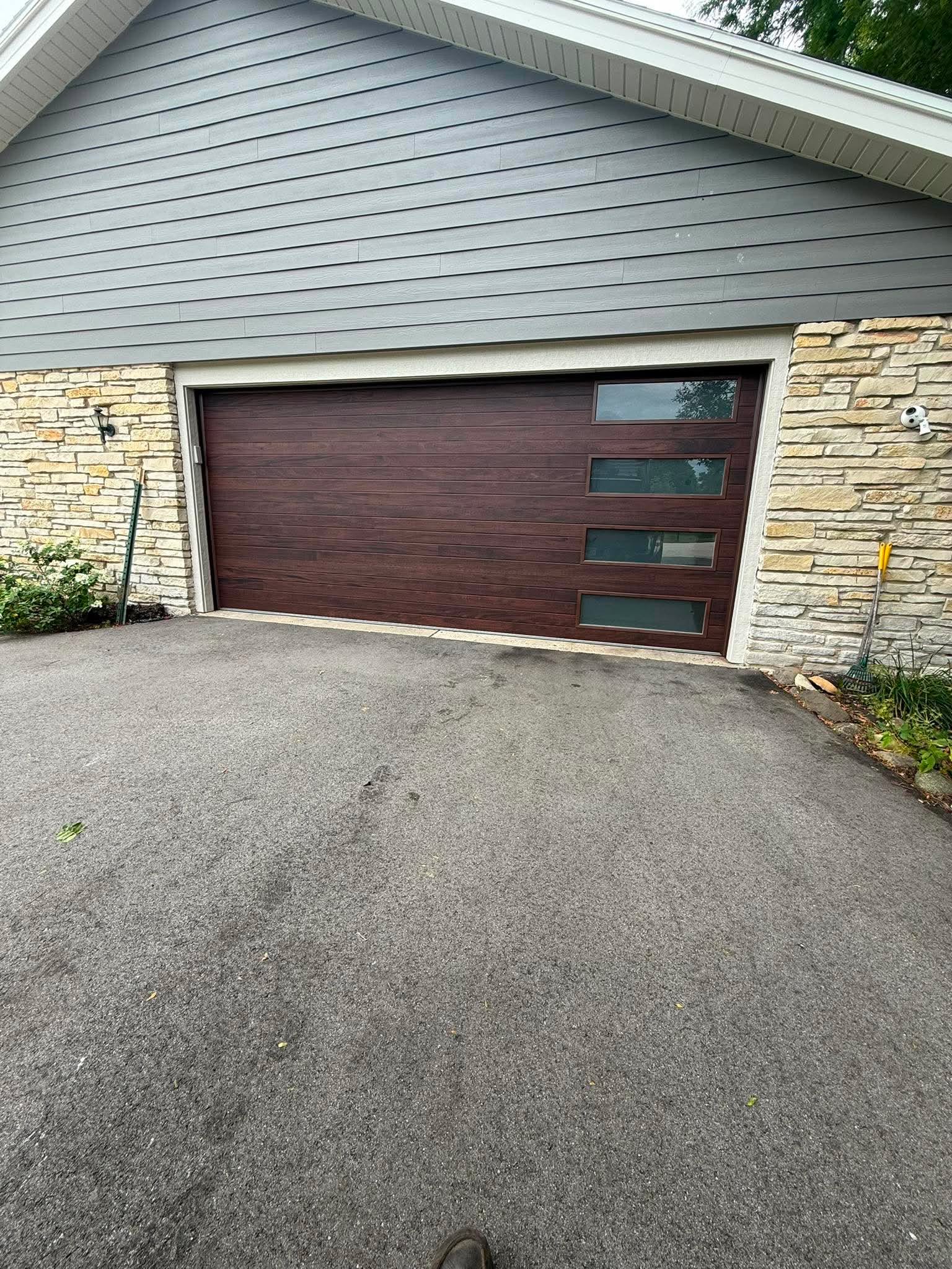 Modern wood-look garage door with stacked windows